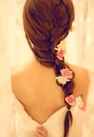 So classy, sexy and elegant! Braid a loose (messy) single braid and tuck flowers of your choice into the braid. Roses are always very elegant and beautiful but I also find that daisies are just as pretty and much easier to work with! 