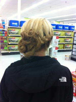 A tight braid in the front and back, curled into a bun. 