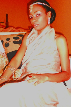 I did the makeup, hair design, clothing and created the shoot concept. the pic portrays a beautiful regal queen meditating in her boudoir before making an appearance.