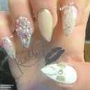 nude and gold stiletto nails