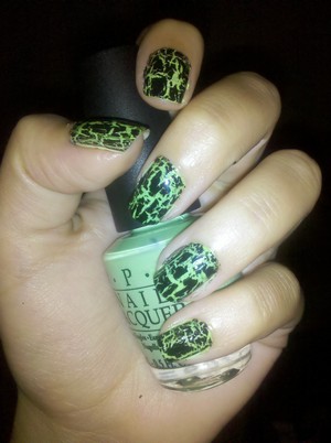 OPI Nail Lacquer - Black Shatter on top of OPI Matte Nail Lacquer - Gargantuan Green Grape

kind of like a "Monster" energy drink green. I used these colors for a Packer game because I didn't have a darker green. Also great for Halloween!