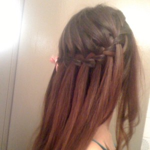 Waterfall braids around the head, sort of like a half-crown :) I prefer loose, wavy curls over tight curls for this. 