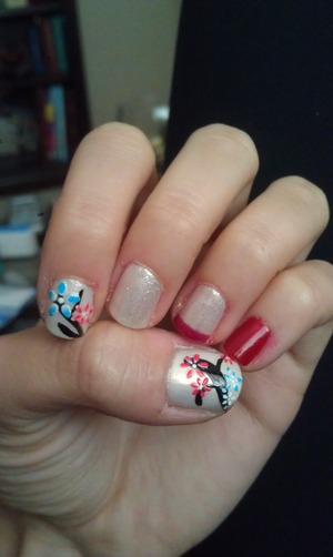 i cheated and used stickers for the flowers :$ ans i still did a top coat to make sure they wouldnt fall