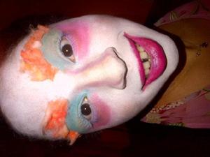 Mad Hatter. Eye Shaddow to do all contouring, and eye makeup, eye shadow mixed with lip balm to make the lip colour and cotton wool dyed orange for the old brows