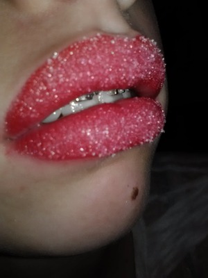 i used a red lipliner 
under a red/pink lipstick, and added a sticky gloss, then added sugar to my lips