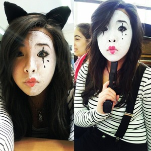 Mime make up using white cream face paint, black liquid eyeliner and red lipstick. 