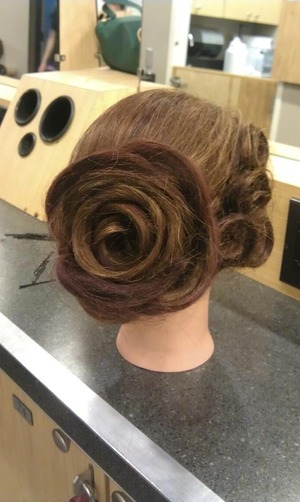 Another rose inspired look, this time incorporated into a french twist. 