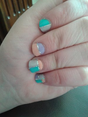 A fun, summer nail art design, using nail polish and striping tape in pastel colours :)