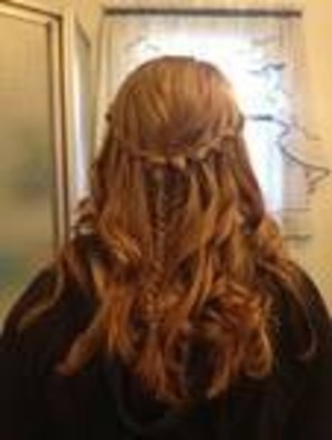 its two waterfall braids into a fishtail. Them I curled it.