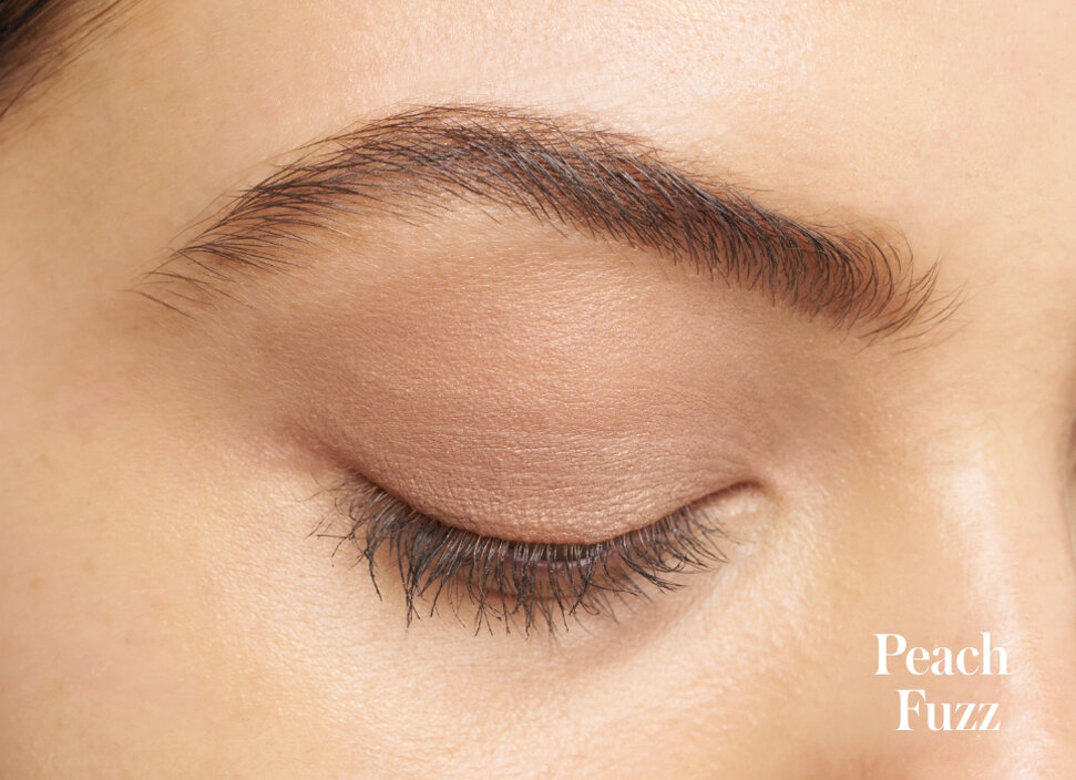 Model wearing the shade Peach Fuzz from the rms beauty Rebel Glow ReDimension Hydra Eyes Quartet