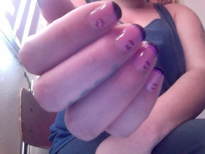 Neutral based nail polish, african violet color lip print, black tips and lined with lilac. 