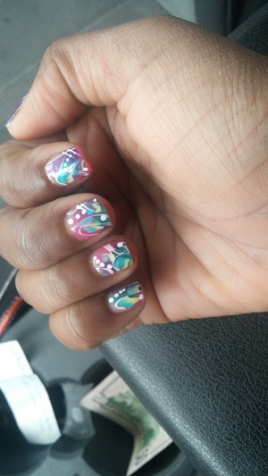 Turquoise, Fuchsia pink, & Purple gel polish nails w/ light pink & white hand design and light blue and pale yellow paint.. Each finger is designed differently.. 