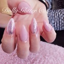 Nude nails with glitter.
