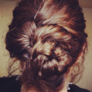 French braid hair from crown and loop the end at the nape of your neck
