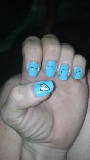 Little paper airplanes on a sky of blue "flying" across my nails :)
