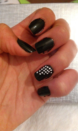 Black with white dots on accent nail, using my nail art pen.