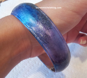 I used nail polish to transform a bracelet. 
http://laurenmicheleblog.com/2012/08/31/diy-galaxy-bracelet/
