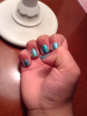 Turquoise nails (can use any color) with matching sparkles and a fuzzy coat used for an accent nail.
