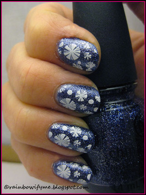 China Glaze's beautiful glitter polish: Skyscraper. 
Read more about it and the stamping on my blog, here:
http://rainbowifyme.blogspot.com/2012/01/china-glaze-skyscraper.html