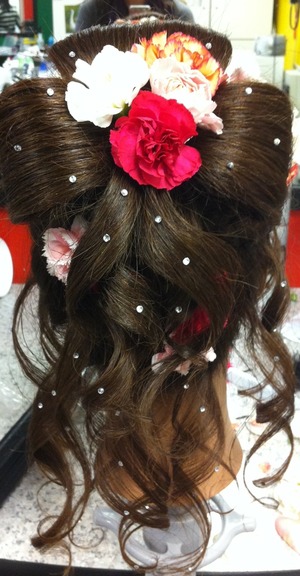 Curling iron flowers hair spray bobby pins hair ties 