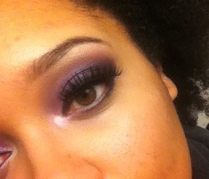 Purple smokey eye with false lashes