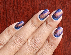 Use the sponging technique to get these gorgeous galaxy nail! For more information see my blog: 
http://chinadolltt.blogspot.com/2012/07/galaxy-nails-with-tutorial.html
