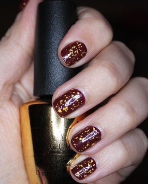 OPI's 'The Man with the Golden Gun' top coat over OPI's 'Skyfall'