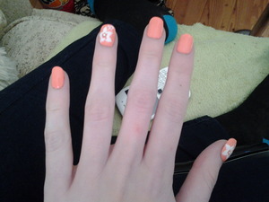 peach nails with white flowers