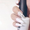 Off white nails with Swarovski cross nails