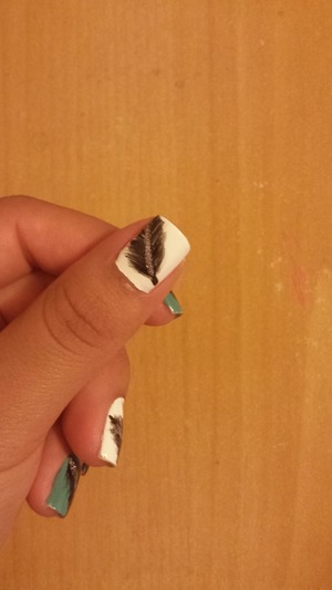 feather designed with nail brushes