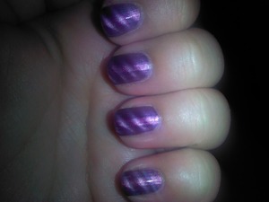i used a purple magnetic polish & then got my magnetic nail design that i got from sally's it has three designs & left it on for about 20 sec take it off and your done =] 