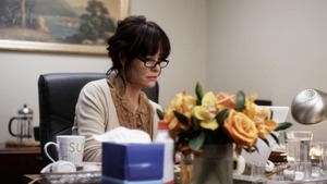a still photo from the movie "PRICE CHECK" with Parker Posey & Eric Mabius - Dyana Aives Dept Head Hair & Makeup