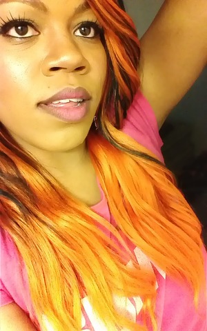 neon orange and black loose curls with feathered bang 
