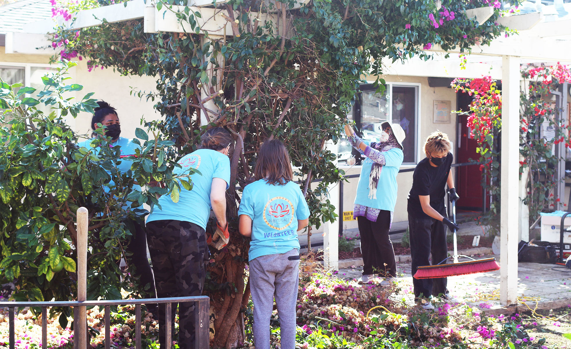 Ruby’s Place staff volunteer day helping with upkeep and renovation of their family shelter.  Image courtesy of Ruby’s Place.