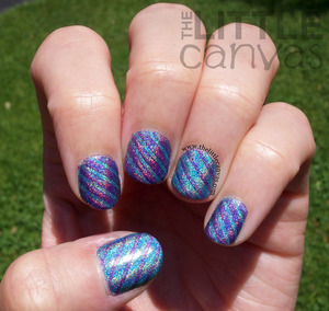 Used Color Club Eternal Beauty and Over the moon to get these beauties - http://www.thelittlecanvas.com/2013/06/holo-tape-manicure.html