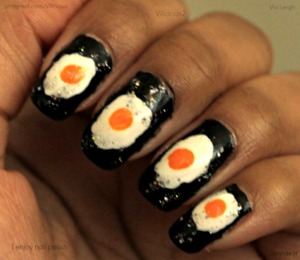Fried egg nail art ^_^ So simple, yet so awesome. All of the nail polishes I used were: Zoya Raven, Milani White On The Spot, Wet n Wild Sunny Side Up, & Wet n Wild Kaleidoscope. Easily one of my all time favorite manicures... Every time I wear it, I crave fried eggs, haha.