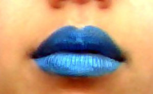 Futuristic blue lips

This look has been achieved by using a mixture of highly pigmented blue eyeshadows