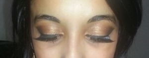 Done this for my birthday, my first time eyeshadow look!

Matte nude/brown base.
Orange/gold in crease and corner.
Shimmery gold in middle.
Black blended in the corner.
Gold in teardrop area.
Finished with eyeliner, false eyelashes and mascara :o)

I used my own collection of drugstore products. 

Feel free to leave comments or any advice you may have perfecting my eyeshadow... im still learning! :o) xx
 