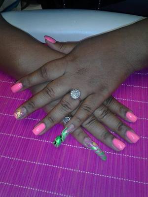neon pink and green spiral and stiletto nails