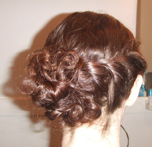 I did my friend's hair for a formal event she had. I twisted her hair back into a curly, side bun. 