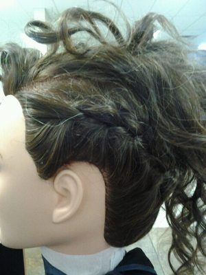 curly mohawk updo with braids down the sides