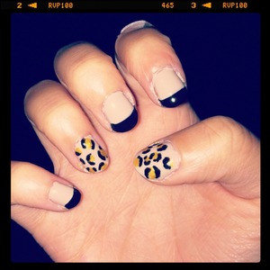 Nude nails with black French tips. Cheetah print for thumb and ring finger. :)