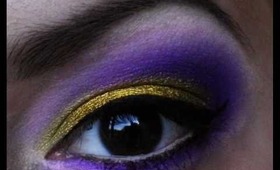 Purple and sparkly gold make up look