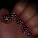 Dark red nails with white polka dots