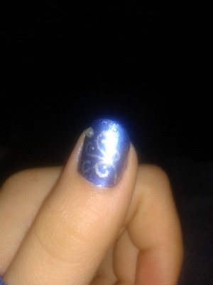 Beautiful blue with silver swirls and a little gem to wrap it up.