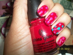 This is really messy D; China Glaze- rouge with Revlon- fuchsia dots and Orly- blue collar on my accent nail