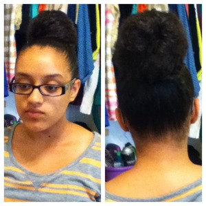 My sister has big poofy curly hair and she put it in a big bun with out a sock bun.... What's you opinion??