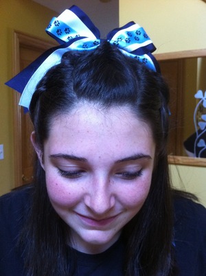 Cheerleading Hair.  Rope braids on the left and right sides and a fishtail down the middle.