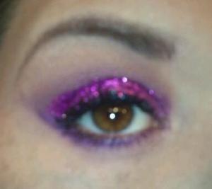 Sorry about the blurry picture.  My first time experimenting applying glitter.  I used MAC's fuchsia glitter and NYX's dancing queen glitter eyeliner.  As a glitter base I used DUO lash adhesive.  Very messy, wouldn't recommend it. 