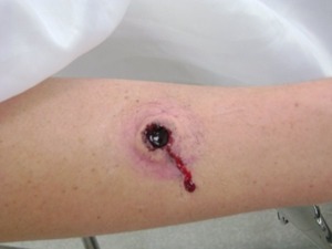 My first attempt at a bullet hole during makeup school.